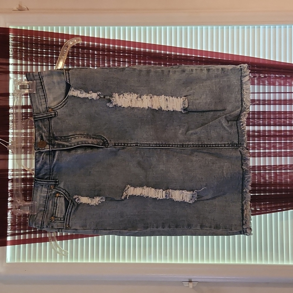 Large mini distressed jean skirt